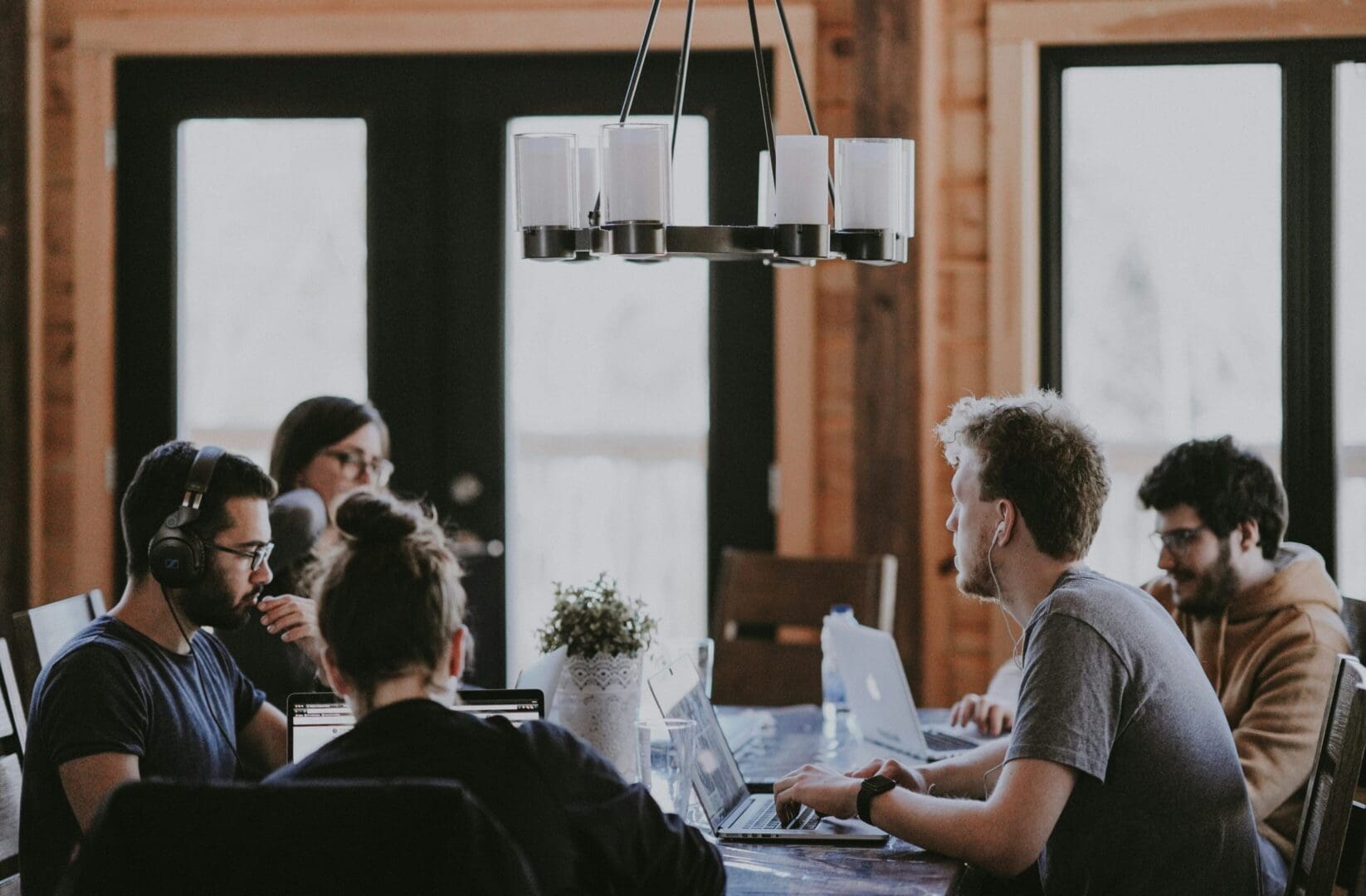 A group of people sitting around a table.